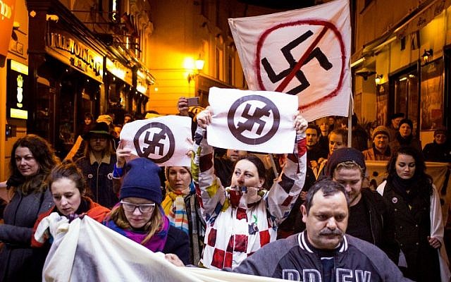 People take part in an anti extreme right rally in reaction to results of parliamentary elections in Bratislava on March 7, 2016.  The neo-Nazi People's Party Our Slovakia (LSNS) led by Marian Kotleba gained 8 percent of the votes. (AFP / VLADIMIR SIMICEK)