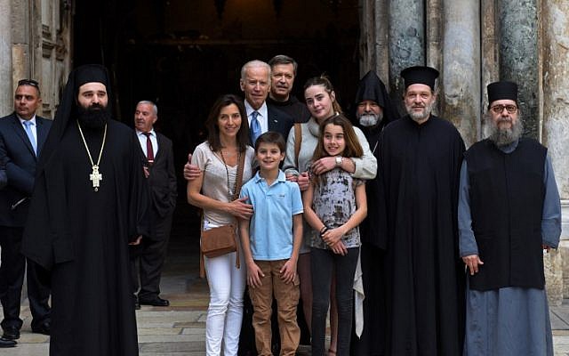 US Vice President Joe Biden poses with his family and priests outside the Church of the Holy Sepulchre in Jerusalem's Old City, March 9, 2016 .(AFP/Debbie Hill)