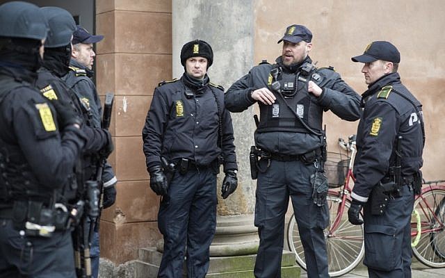 Danish policemen stand guard in front of the city court in Copenhagen, Denmark, March 10, 2016. (AFP/Scanpix Denmark/Emil Hougaard)