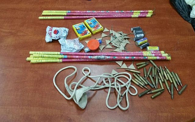 Ammunition, firecrackers, and a sling shot discovered by police in the Od Yosef Hai yeshiva in the West Bank settlement of Yitzhar, March 15, 2016. (Israel Police)
