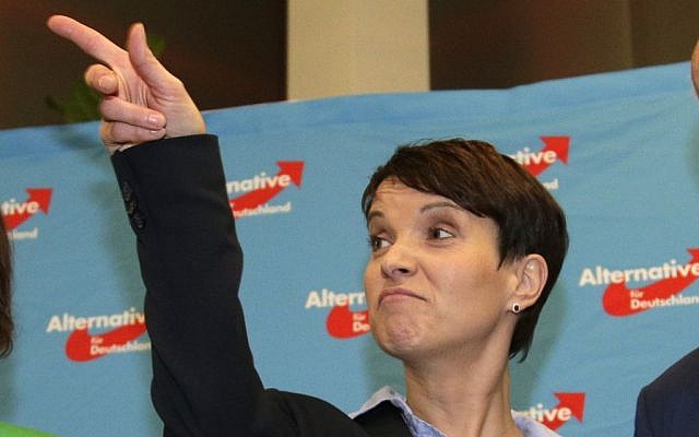 Frauke Petry, chairwoman of the AfD, points her finger at the gathering of the right-populist AfD (Alternative for Germany) after the closing of the state elections in the German federal states of Baden-Wuerttemberg, Rhineland-Palatinate and Saxony-Anhalt in Berlin, Germany, Sunday, March 13, 2016. (AP Photo/Michael Sohn)