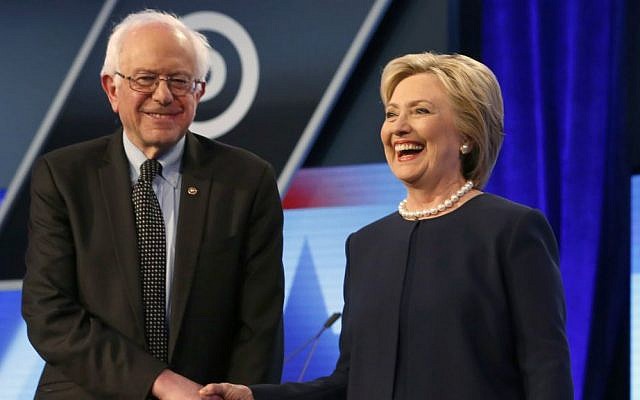 Democratic presidential candidates Hillary Clinton and Sen. Bernie Sanders, I-Vermont, shake hands before the start of the Univision, Washington Post Democratic presidential debate at Miami-Dade College in Miami, Florida, Wednesday, March 9, 2016. (AP Photo/Wilfredo Lee)