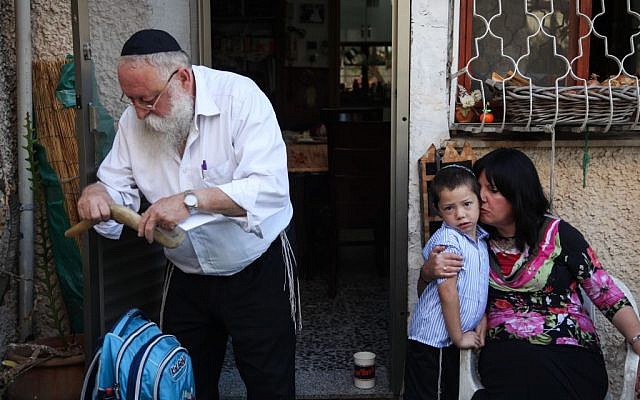 Moshe Holtzberg seen on his first day at first grade in the city of Migdal Haemek on August 26,2012. Rabbi Gavriel Noach Holtzberg and his wife, Rivka, who was five months pregnant, were killed during the November 2008 Mumbai attacks by Pakistani Islamic terrorists. Their two-year-old son Moshe survived the attack after being rescued by his Indian nanny, Sandra Samuel. (Avishag Shaar Yashuv/Flash90)