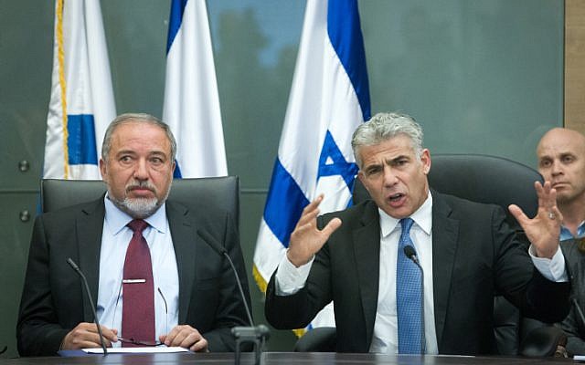 Yesh Atid leader Yair Lapid and Yisrael Beytenu party leader Avigdor Liberman in the Knesset on February 29, 2016. (Miriam Alster/Flash90)
