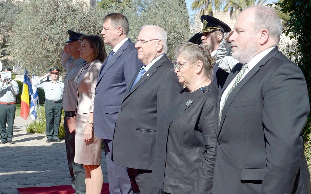 Reuven Rivlin, third right, and Romanian president Klaus Iohannis at a ceremony in Jerusalem on March 7, 2016. (Mark Neyman/GPO)