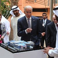 Joe Biden points to one of the Masdar City employees as Sultan Ahmed Al Jaber UAE minister of state and the chairman of Masdar City, third left, looks on during his first day tour in Abu Dhabi, United Arab Emirates, Monday, March 7, 2016. (AP/Kamran Jebreili)