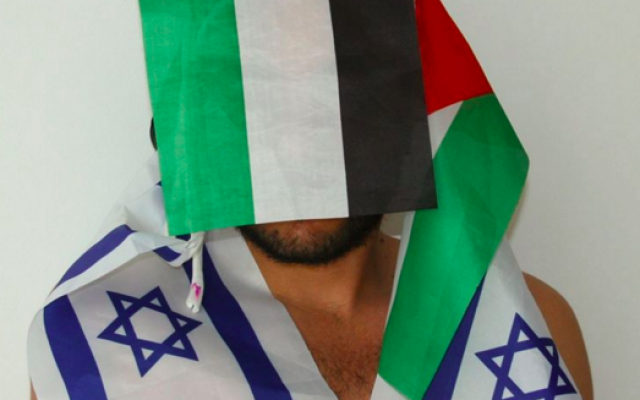 Khader Abu-Seif draped in opposing flags for part of the Celebration series by photographer Xavier Klaine (Courtesy Xavier Klaine)