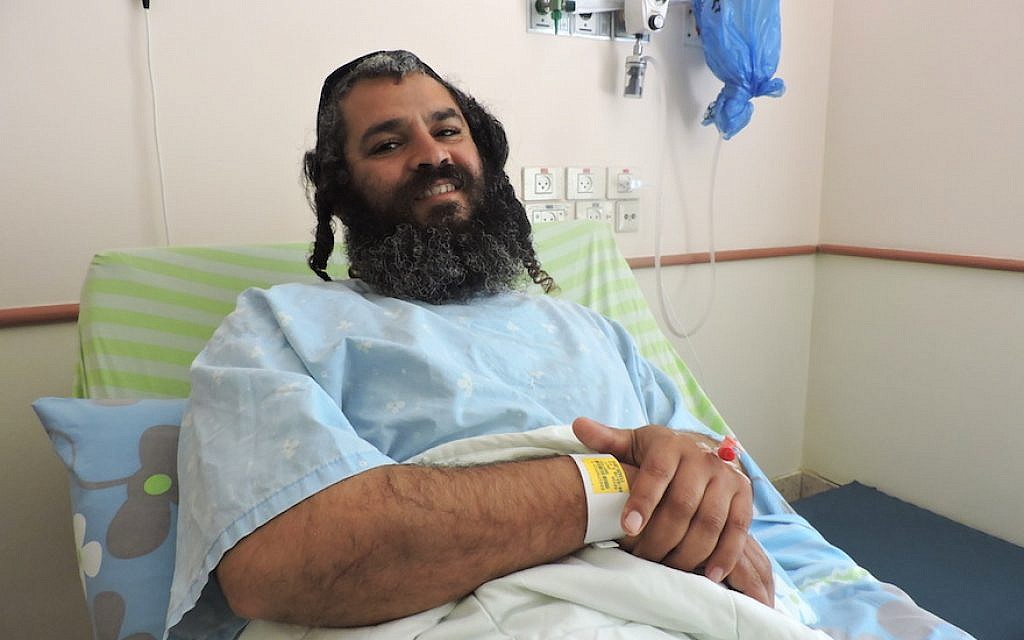 Yonatan Azriaev recovering from his wounds at a Petah Tikvah hospital, March 10, 2016. (Ben Sales, via JTA)