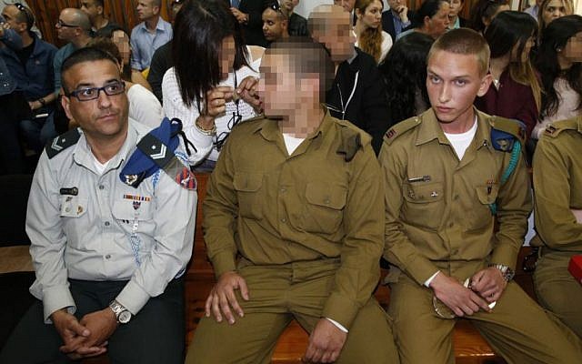An IDF soldier who was filmed shooting a disarmed Palestinian assailant in the head attends a hearing in his case at a military court near Kiryat Malachi on March 29, 2016 (POOL/Flash90)