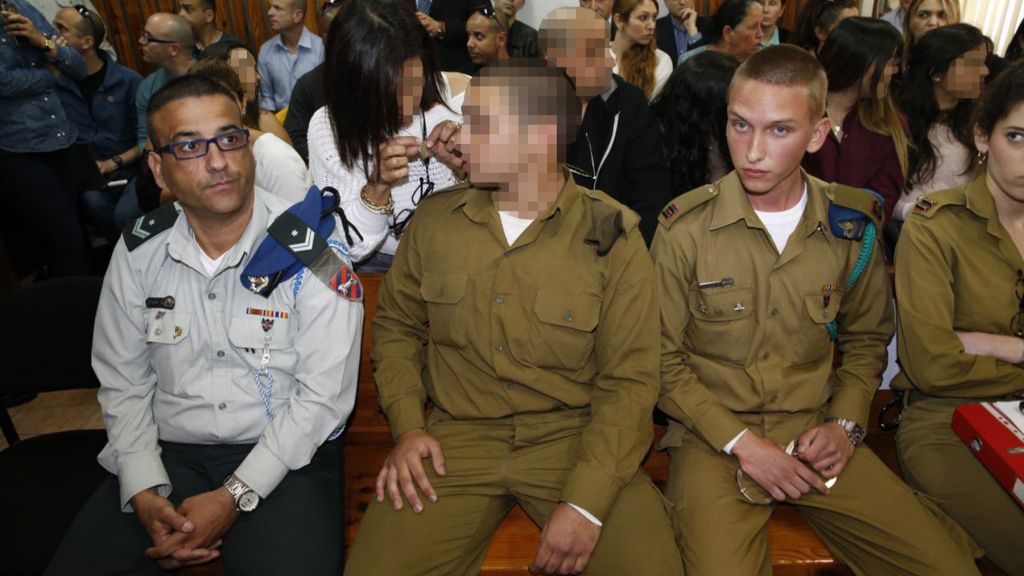 An IDF soldier who was filmed shooting a disarmed Palestinian assailant in the head attends a hearing in his case at a military court near Kiryat Malachi on March 29, 2016 (POOL/Flash90)