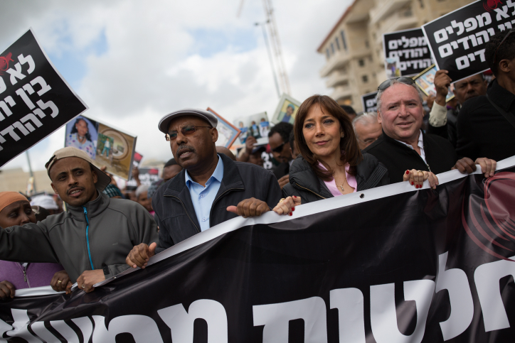 Likud MK Avraham Neguise (second from left). Zionist Union MK Revital Swid (Second from R), and Likud MK David Amsalem (R) during a protest on Ethiopian Israeli immigration in Jerusalem, on March 20, 2016. (Corinna Kern/Flash90 )