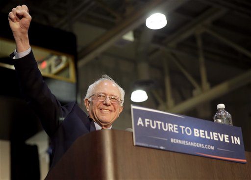 Democratic presidential candidate Sen. Bernie Sanders, I-Vermont, greets his supporters as he arrives at Grand Valley State University Field House Arena in Allendale, Michigan, Friday, March 4, 2016. (AP Photo/Nam Y. Huh)