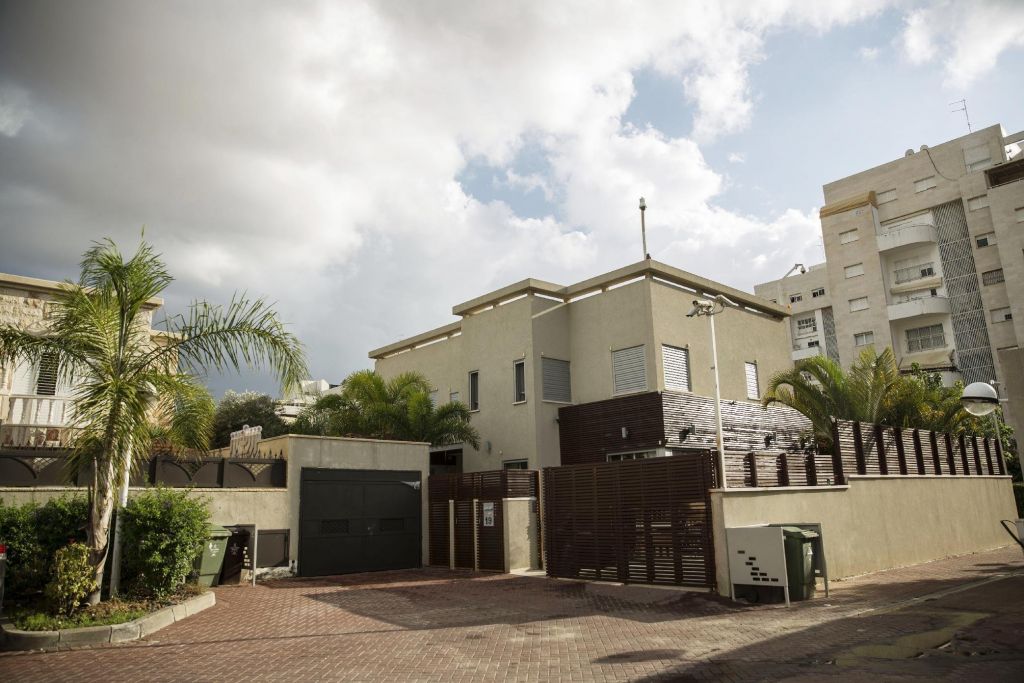 In this Tuesday, Nov. 10, 2015, photo, the house belonging to convicted con man Gilbert Chikli is seen in the port city of Ashdod, Israel. Chikli remains a wanted man, but lives openly in Israel. Israel and France share no bilateral extradition treaty, but Israel has surrendered French citizens in the past. (AP Photo/Tsafrir Abayov)