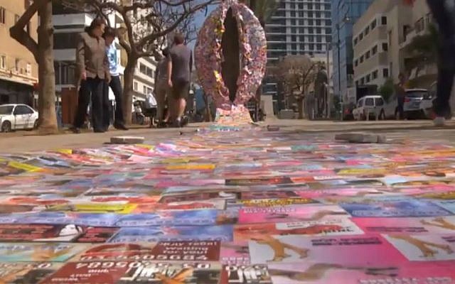 A 10-foot vagina sculpted from cards advertising prostitution services. The piece, by Sasha Kurbatov and Vanan Borian, was placed on Rothschild Avenue in Tel Aviv on Tuesday, March 8 2016, to coincide with International Woman's Day. (Screen capture Ynet)