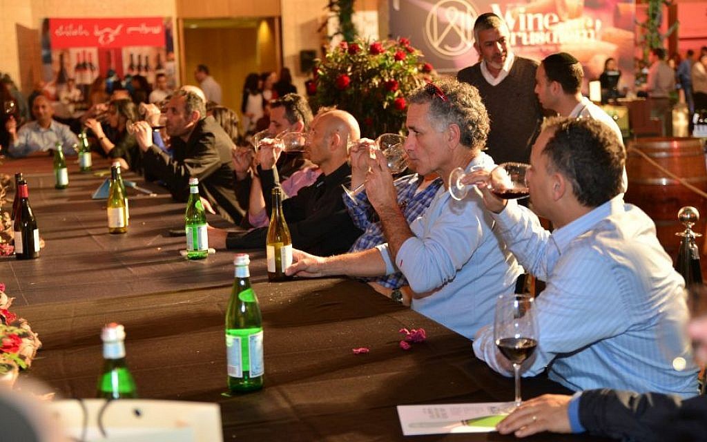 Tasting and spitting at Wine Jerusalem 2015; this year's expo opens Wednesday night at Binyanei Hauma, the International Convention Center (Courtesy Wine Jerusalem)