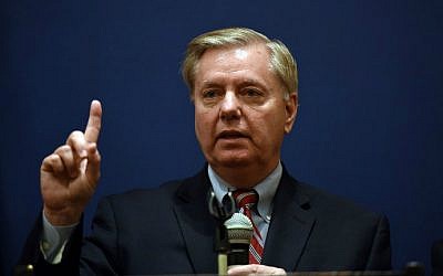 Senator Lindsey Graham gestures during a press conference with members of his Congressional delegation in Caira, Egypt, on April 3, 2016. (AFP/Mohamed el-Shahed)