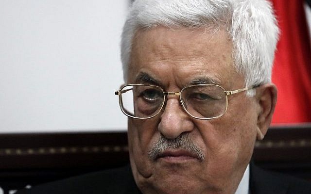 Palestinian Authority President Mahmud Abbas listens during an exclusive interview with AFP reporters in his office in the West Bank city of Ramallah on April 11, 2016. (AFP PHOTO / THOMAS COEX)