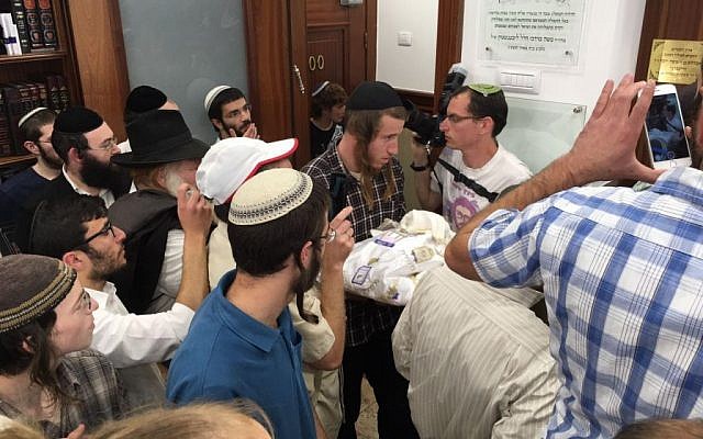 The circumcision of Netzach Binyamin Ettinger in Jerusalem on April 4, 2016.  (Ari Abramowitz/courtesy)