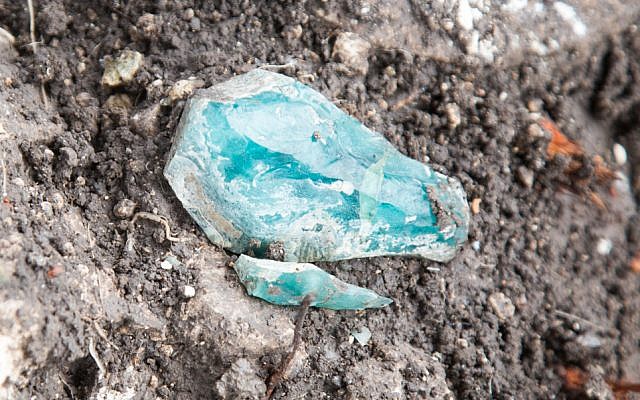 Small fragments of raw Judaean glass as they were found at a Roman-era site in northern Israel in 2015. (Shmuel Magal, courtesy of Israel Antiquities Authority)