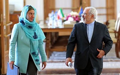 Iranian Foreign Minister Mohammad Javad Zarif, right, and the European Union foreign policy chief Federica Mogherini arrive to attend a press briefing after their meeting, in Tehran, Iran, Saturday, April 16, 2016. (AP /Ebrahim Noroozi)