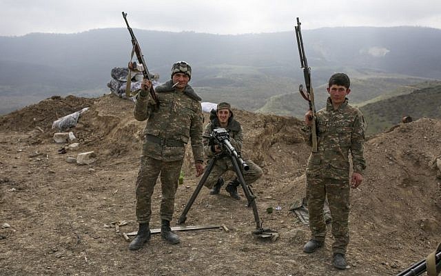 Armenian soldiers pose near a frontline in Nagorno-Karabakh, Azerbaijan, April 6, 2016. (Karo Sahakyan/PAN via AP)