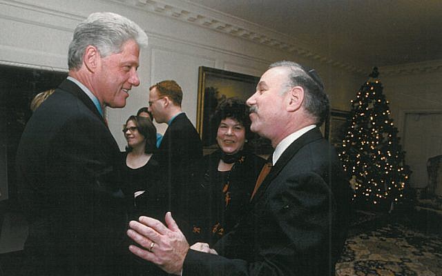 Bob and Helene Fine meeting President Bill Clinton at the White House in December 2000, a few months after hosting first lady Hillary Clinton and daughter Chelsea for Passover seder. (Courtesy of Bob Fine via JTA)
