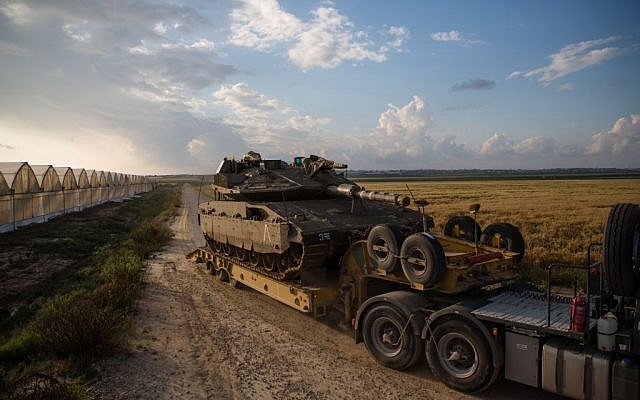 A tank is transported near Kibbutz Be'eri just outside the central Gaza Strip on April 13, 2016. (Corinna Kern/Flash90)