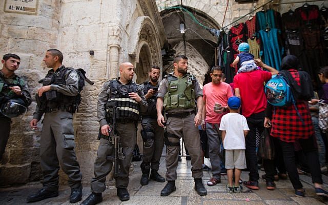Israeli police officers guard an entrance to the Al-Aqsa Mosque and Temple Mount in Jerusalem's Old City during the Jewish holiday of Passover, on April 24, 2016. (Corinna Kern/Flash90)