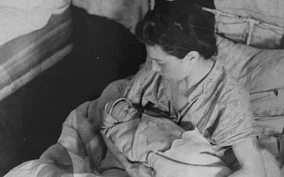 A mother cradles her new born baby in the Kovno ghetto hospital. (United States Holocaust Memorial Museum, courtesy of George Kadish/Zvi Kadushin)