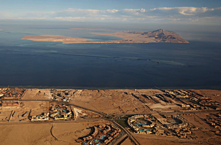 The Red Sea islands of Tiran, in the foreground, and Sanafir, in the background, sit at the the Strait of Tiran between Egypt’s Sinai Peninsula and Saudi Arabia (Stringer/AFP/Getty Images, via JTA)