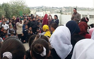 Image taken from deleted Facebook post of an event at the Jabal Mukaber Elementary school, in which family members of Palestinian attacker Bahaa Allyan were invited to speak. (Courtesy: Facebook)