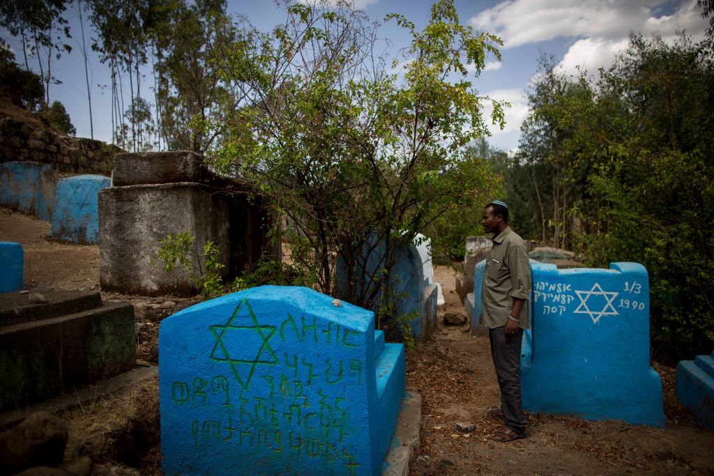 Gashaw Abinet, 29, a cantor at the HaTikvah synagogue in Gondar, visits Wolleka and its Jewish cemetery for the first time on April 24, 2016, although he has lived in Gondar for 17 years awaiting aliyah. (Miriam Alster / Flash9)