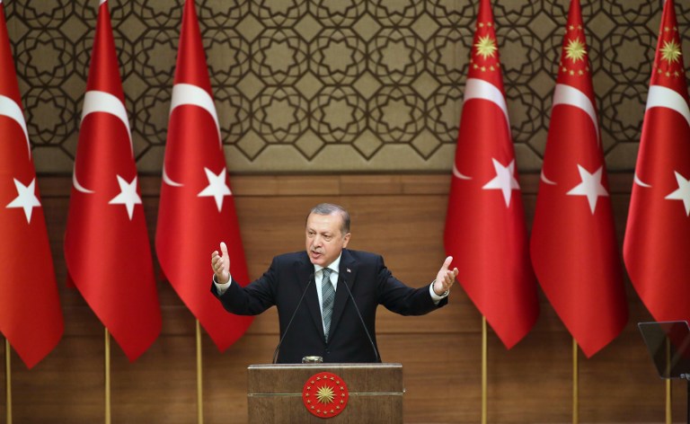 Turkish President Tayyip Erdogan gestures during a speech with local village and town leaders at the Presidential Palace in Ankara, on May 4, 2016. (AFP/Adem Altan)