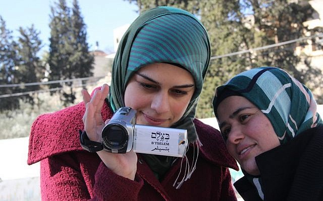 Palestinian volunteers with the B'Tselem human rights organization learn how to use video cameras to document the actions of the IDF and Israeli settlers in the West Bank, in 2014. (B'Tselem/CC BY 4.0)