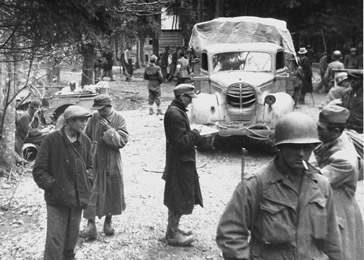Survivors and American troops in Gunskirchen, a subcamp of the Mauthausen concentration camp, after liberation. Gunskirchen, Austria, May 6–15, 1945.