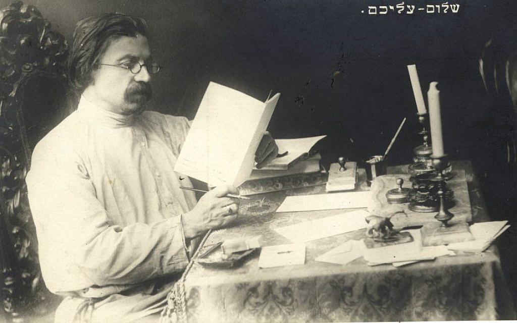 Famed Yiddish author Shalom Aleichem, whose centennial yahrzeit was May 22, 2016, seated at his writing desk. (Courtesy YIVO Institute for Jewish Research)