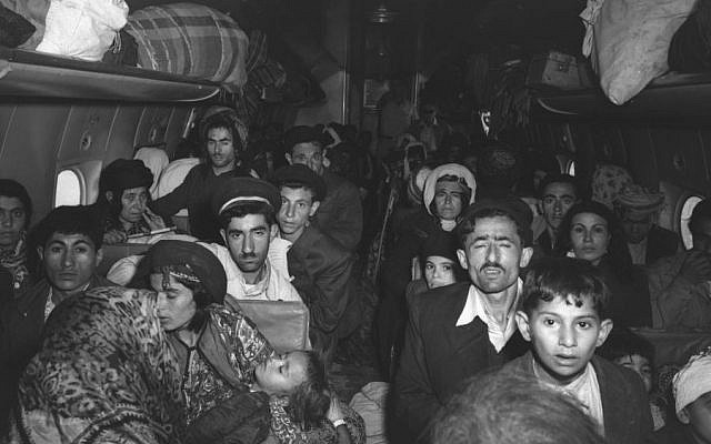 A plane filled with Iraqi Jews photographed on arrival at Lod Airport outside Tel Aviv in early 1951 (Teddy Brauner, GPO)