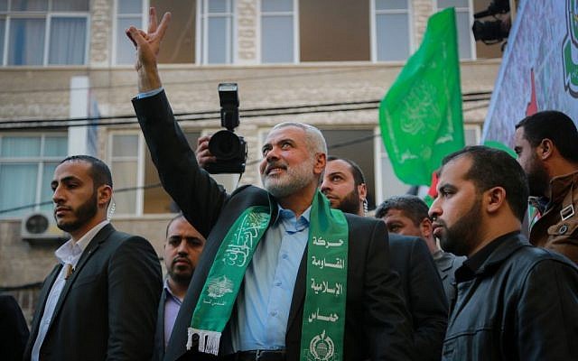 Senior Hamas leader Ismail Haniyeh gestures to the crowd as he takes part in a rally marking the 28th anniversary of Hamas's founding, in Gaza City on December 14, 2015. (Emad Nassar/Flash90)