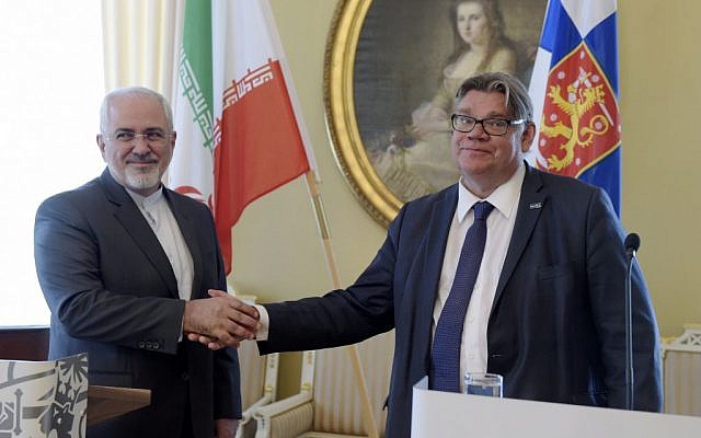 Iran's Foreign Minister Mohammad Javad Zarif and Finnish Foreign Minister Timo Soini shake hands at a press conference in Helsinki, May 31, 2016. (Vesa Moilanen/ Lehtikuva via AP)