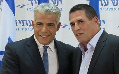 Former deputy police commissioner Yoav Segalovich together with Yesh Atid chair Yair Lapid after announcing he would be joining the party, May 29, 2016. (Courtesy)