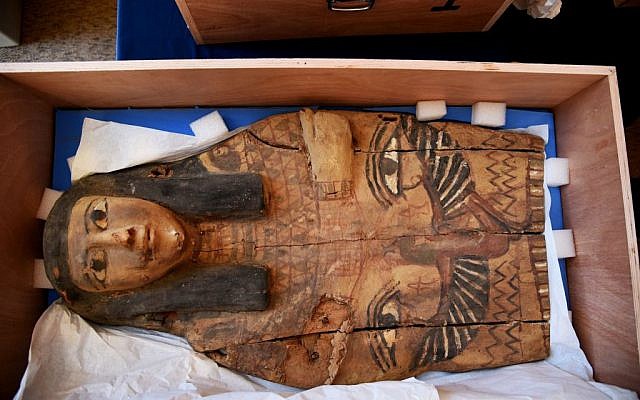 This undated photo released by the Israeli Foreign Ministry shows a part of sarcophagus cover in Israel. Israel's Antiquities Authority says the colorful sarcophagus covers date back as early as the 16th and 10th centuries BCE. (Israeli Foreign Ministry via AP)