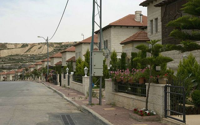 In this photo made Monday, May 9, 2016, a line of villas is seen in the Palestinian Diplomatic Neighborhood at the outskirts of the West Bank city of Ramallah. (AP Photo/Nasser Nasser)