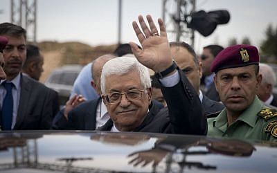 Palestinian Authority President Mahmoud Abbas waves to media during opening the Palestinian Museum to the public in the West Bank town of Bir Zeit , Wednesday, May 18, 2016. (AP Photo/Majdi Mohammed) 