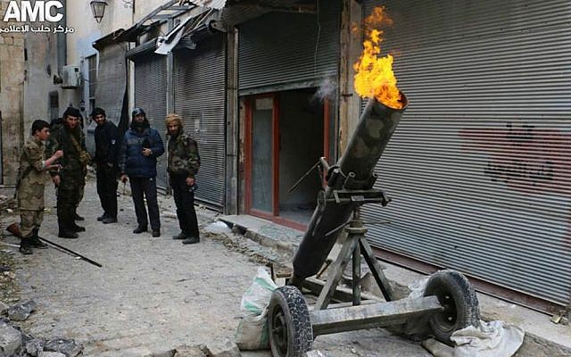 In this Sunday Feb. 15, 2015 file photo by the Syrian anti-government activist group Aleppo Media Center (AMC) shows Syrian rebels firing locally made shells against Syrian government forces, in Aleppo, Syria. (AP Photo/Aleppo Media Center, AMC, File)