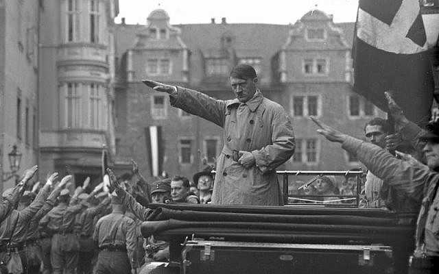 Adolf Hitler at a Nazi rally in Weimar, Germany, October 1930 (public domain)
