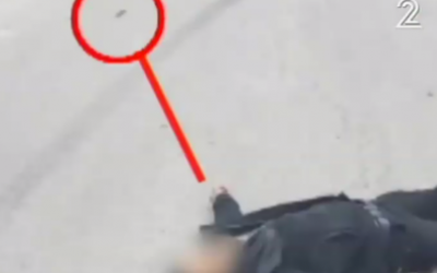 A wounded assailant lying some distance from a knife in Hebron on March 24, 2016 (Channel 2 screenshot)