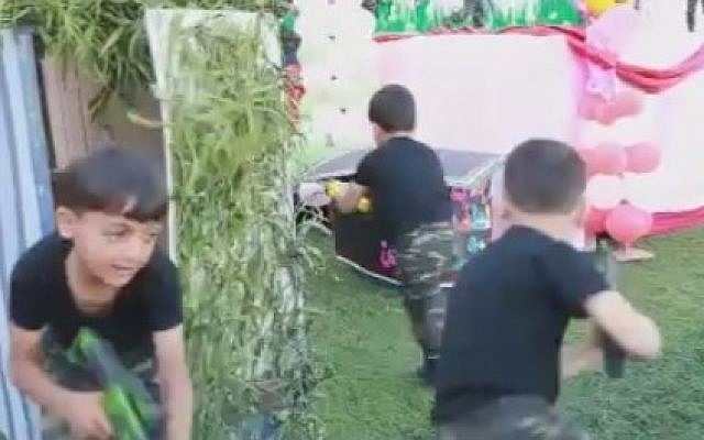 Young Palestinian boys emerge from a 'tunnel' as part of a presentation at a children's festival in the Gaza Strip, April 2016 (Courtesy MEMRI)