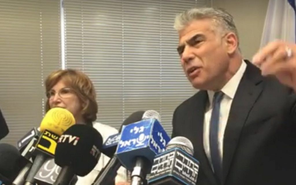 Yesh Atid leader Yair Lapid, right, is accompanied by MK Yael German as he speaks at a press conference from the Knesset in Jerusalem on May 23, 2016 (screen capture: Facebook)