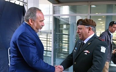 Then-newly appointed Defense Minister Avigdor Liberman alongside IDF Chief of Staff Gadi Eisenkott during a ceremony welcoming him to the ministry, May 31, 2016. (Ariel Harmoni/Ministry of Defense)