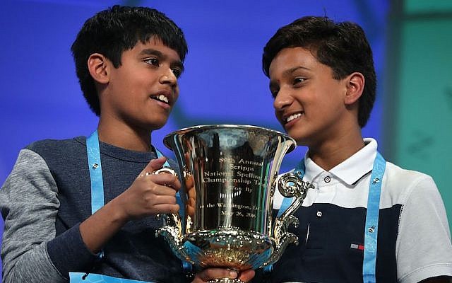 Spellers Nihar Saireddy Janga, left, of Texas and Jairam Jagadeesh Hathwar of New York hold a trophy after the finals of the 2016 Scripps National Spelling Bee, on May 26, 2016 in National Harbor, Maryland. (Photo by Alex Wong/Getty Images via JTA)